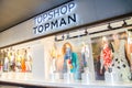 Topshop Topman fashion clothing and accessories retail store, the image shows shopfront at night. Royalty Free Stock Photo